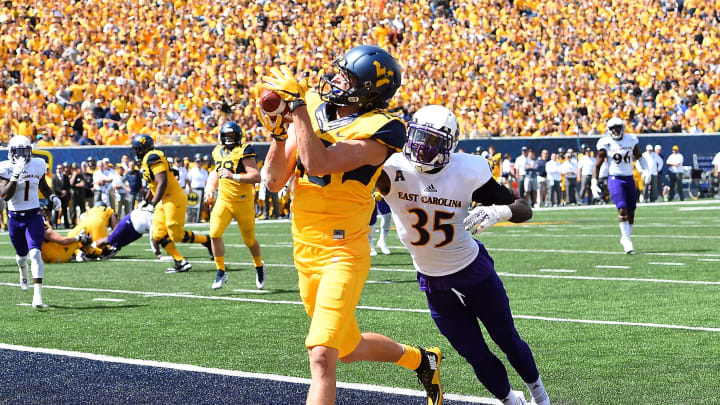 MORGANTOWN, WV – SEPTEMBER 09: David Sills V #13 of the West Virginia Mountaineers makes a touchdown catch in front of Chris Love #35 of the East Carolina Pirates during the second quarter at Mountaineer Field on September 9, 2017 in Morgantown, West Virginia. (Photo by Joe Sargent/Getty Images)