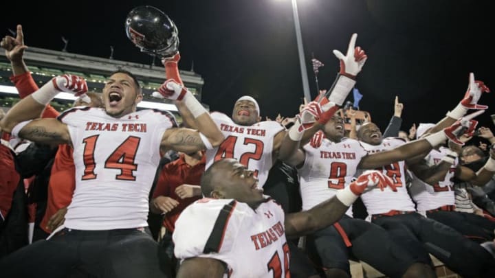 NORMAN, OK - OCTOBER 22: Texas Tech players celebrate after the game against the Oklahoma Sooners October 22, 2011 at Gaylord Family-Oklahoma Memorial Stadium in Norman, Oklahoma. Texas Tech upset Oklahoma 41-38. (Photo by Brett Deering/Getty Images)