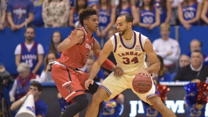 Feb 27, 2016; Lawrence, KS, USA; Kansas Jayhawks forward Perry Ellis (34) dribbles the ball as Texas Tech Red Raiders forward Justin Gray (5) defends during the first half at Allen Fieldhouse. The Jayhawks won 67-58, winning their twelfth consecutive Big 12 titles. Mandatory Credit: Denny Medley-USA TODAY Sports Feb 27, 2016; Lawrence, KS, USA; Kansas Jayhawks forward Perry Ellis (34) dribbles the ball as Texas Tech Red Raiders forward Justin Gray (5) defends during the first half at Allen Fieldhouse. The Jayhawks won 67-58, winning their twelfth consecutive Big 12 titles. Mandatory Credit: Denny Medley-USA TODAY Sports