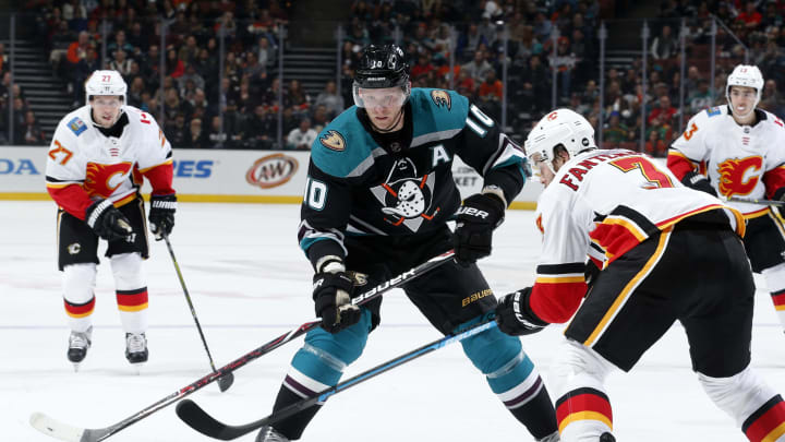 ANAHEIM, CA – APRIL 3: Corey Perry #10 of the Anaheim Ducks battles for the puck against Oscar Fantenberg #3 of the Calgary Flames during the game on April 3, 2019 at Honda Center in Anaheim, California. (Photo by Debora Robinson/NHLI via Getty Images)