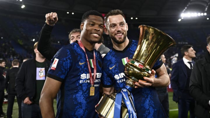 STADIO OLIMPICO, ROME, ITALY - 2022/05/12: Denzel Dumfries (L) and Stefan de Vrij of FC Internazionale pose with the trophy during the award ceremony at the end of the Coppa Italia final football match between Juventus FC and FC Internazionale. FC Internazionale won 4-2 over Juventus FC after extra time. (Photo by Nicolò Campo/LightRocket via Getty Images)