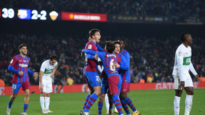 Nico Gonzalez of FC Barcelona celebrates with teammates after scoring the team's third goal during the LaLiga match between FC Barcelona and Elche CF at Camp Nou on December 18, 2021 in Barcelona, Spain. (Photo by Alex Caparros/Getty Images)