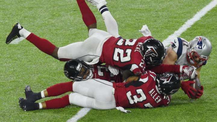 HOUSTON, TX - FEBRUARY 05: Julian Edelman #11 of the New England Patriots catches the pass over Keanu Neal #22 and Ricardo Allen #37 of the Atlanta Falcons during Super Bowl 51 at NRG Stadium on February 5, 2017 in Houston, Texas. The Patriots defeat the Atlanta Falcons 34-28 in overtime. (Photo by Focus on Sport/Getty Images)