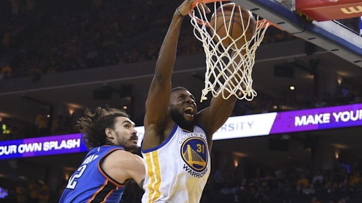 May 18, 2016; Oakland, CA, USA; Golden State Warriors center Festus Ezeli (31) dunks the basketball against Oklahoma City Thunder center Steven Adams (12) during the second quarter in game two of the Western conference finals of the NBA Playoffs at Oracle Arena. Mandatory Credit: Kyle Terada-USA TODAY Sports