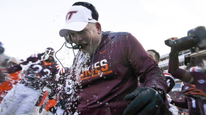 BLACKSBURG, VA - NOVEMBER 26: Head coach of the Virginia Tech Hokies Justin Fuente reacts to his ice bath following the victory against the Virginia Cavaliers at Lane Stadium on November 26, 2016 in Blacksburg, Virginia. Virginia Tech defeated Virginia 52-10. (Photo by Michael Shroyer/Getty Images)