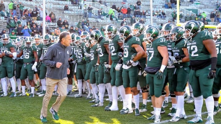 Nov 28, 2015; East Lansing, MI, USA; Michigan State Spartans head coach Mark Dantonio leads the team onto the field prior to a game against the Penn State Nittany Lions at Spartan Stadium. Mandatory Credit: Mike Carter-USA TODAY Sports