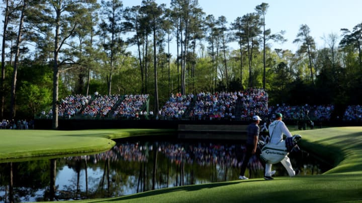 AUGUSTA, GEORGIA - APRIL 10: Scottie Scheffler and caddie Ted Scott walk across the 15th hole hole during the final round of the Masters at Augusta National Golf Club on April 10, 2022 in Augusta, Georgia. (Photo by Andrew Redington/Getty Images)