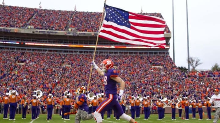 Nov 21, 2015; Clemson, SC, USA; Clemson Tigers wide receiver Sean Mac Lain (88) carries the American flag prior to the game against the Wake Forest Demon Deacons at Clemson Memorial Stadium. Mandatory Credit: Joshua S. Kelly-USA TODAY Sports