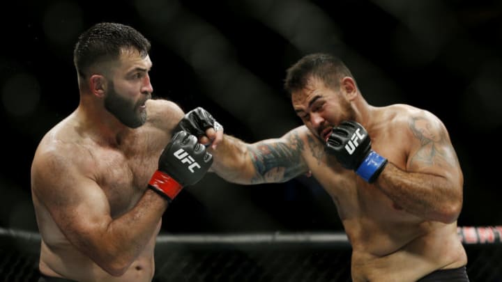 SUNRISE, FLORIDA - APRIL 27: Augusto Sakai of Brazil punches Andrei Arlovski of Belarus during their heavyweight bout at UFC Fight Night at BB&T Center on April 27, 2019 in Sunrise, Florida. (Photo by Michael Reaves/Getty Images)
