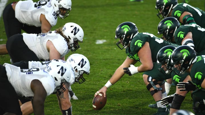 Nov 28, 2020; East Lansing, Michigan, USA; Michigan State Spartans offensive line lines up against the Northwestern Wildcats defensive line during the game at Spartan Stadium. Mandatory Credit: Tim Fuller-USA TODAY Sports