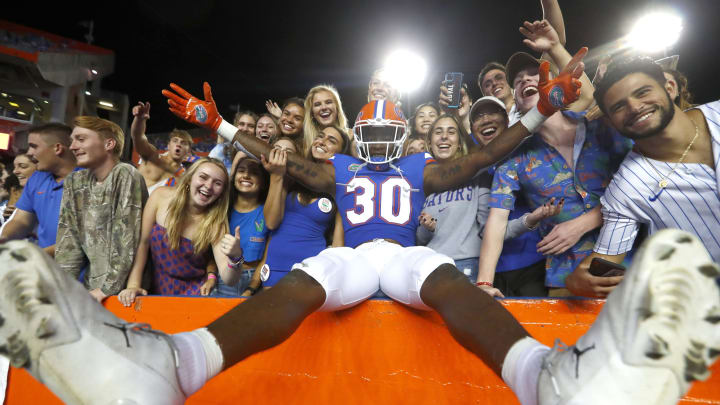 Sep 25, 2021; Gainesville, Florida, USA; Florida Gators linebacker Diwun Black (30) celebrates with fans as they beat the Tennessee Volunteers at Ben Hill Griffin Stadium. Mandatory Credit: Kim Klement-USA TODAY Sports