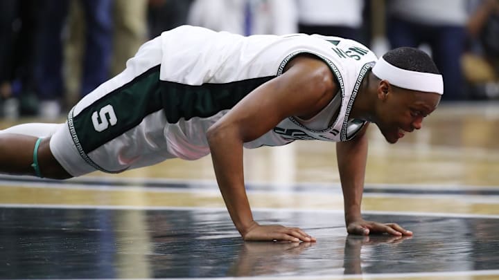 EAST LANSING, MICHIGAN – MARCH 08: Cassius Winston #5 of the Michigan State Spartans kisses the center court logo at the Breslin Center after leaving the floor in his final home game on March 08, 2020 in East Lansing, Michigan. Michigan State won the game 80-69. (Photo by Gregory Shamus/Getty Images)