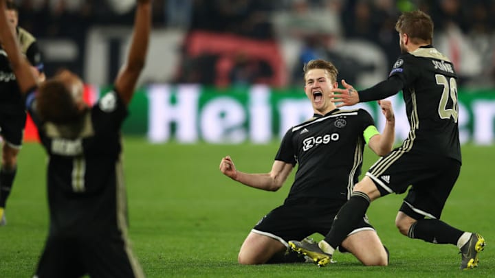 TURIN, ITALY - APRIL 16: Matthijs de Ligt (C) of Ajax celebrates his sides 2-1 victory with Lasse Schone at the final whistle during the UEFA Champions League Quarter Final second leg match between Juventus and Ajax at Juventus Stadium on April 16, 2019 in Turin, Italy. (Photo by Michael Steele/Getty Images)