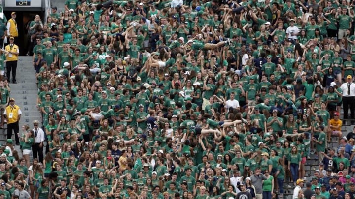 Sep 26, 2015; South Bend, IN, USA; Notre Dame Fighting Irish fans do push ups after scoring a touchdown against the University of Massachusetts at Notre Dame Stadium. Notre Dame defeats Massachusetts 62-27. Mandatory Credit: Brian Spurlock-USA TODAY Sports