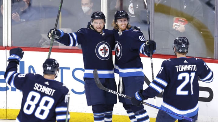 Mar 8, 2022; Winnipeg, Manitoba, CAN; Winnipeg Jets left wing Kyle Connor (81) celebrates his third period goal against the Tampa Bay Lightning at Canada Life Centre. Mandatory Credit: James Carey Lauder-USA TODAY Sports