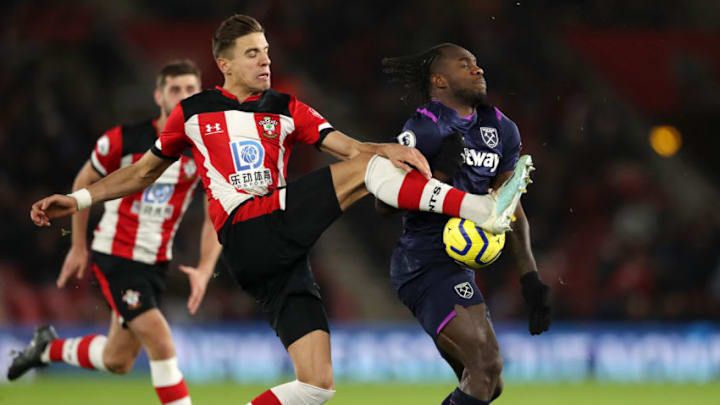 SOUTHAMPTON, ENGLAND - DECEMBER 14: Michail Antonio (R) has a goal disallowed after the ball appears to come off his hand in the build-up during the Premier League match between Southampton FC and West Ham United at St Mary's Stadium on December 14, 2019 in Southampton, United Kingdom. (Photo by Naomi Baker/Getty Images)