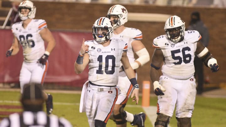 Dec 12, 2020; Starkville, Mississippi, USA; Auburn Tigers quarterback Bo Nix (10) reacts after a touchdown against the Mississippi State Bulldogs during the fourth quarter at Davis Wade Stadium at Scott Field. Mandatory Credit: Matt Bush-USA TODAY Sports