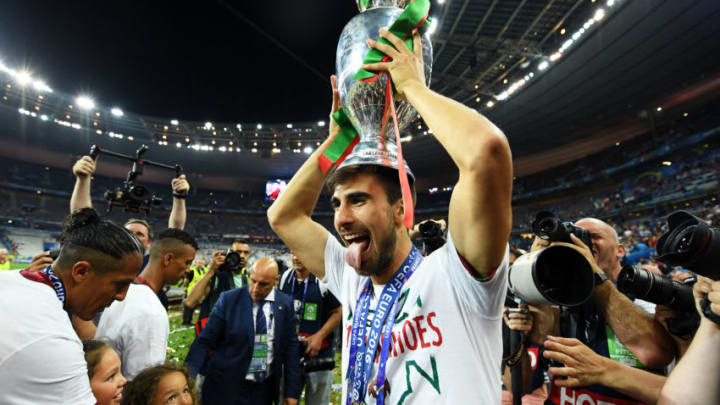 PARIS, FRANCE - JULY 10: Rafa Silva of Portugal holds the Henri Delaunay trophy to celebrate after his team's 1-0 win against France in the UEFA EURO 2016 Final match between Portugal and France at Stade de France on July 10, 2016 in Paris, France. (Photo by Matthias Hangst/Getty Images)