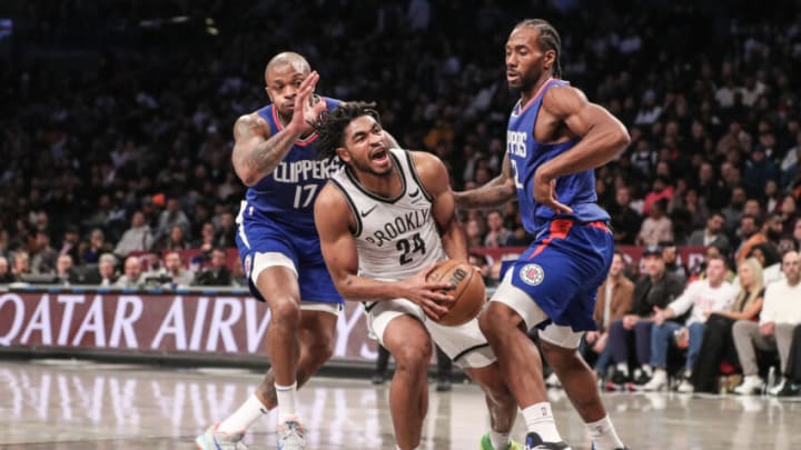 Nov 8, 2023; Brooklyn, New York, USA; Brooklyn Nets guard Cam Thomas (24) is double teamed by LA Clippers forwards P.J. Tucker (17) and Kawhi Leonard (2) in the second quarter at Barclays Center. Mandatory Credit: Wendell Cruz-USA TODAY Sports