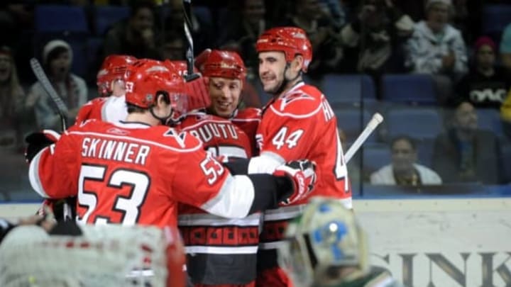 Hurricanes’ Jeff Skinner (L), Jay Harrison (R), and Jussi Jokinen (L) celebrate Tuomo Ruutu’s (C) game-tying 1-1 goal during the ice hockey NHL regular-season game Carolina Hurricanes vs Minnesota Wild in Helsinki on October 8, 2010. AFP PHOTO LEHTIKUVA / Heikki Saukkomaa *** FINLAND OUT *** (Photo by – / LEHTIKUVA / AFP) (Photo credit should read -/AFP via Getty Images)