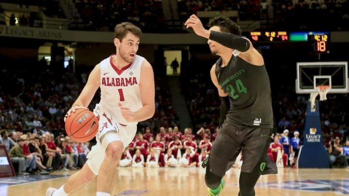 Dec 21, 2015; Birmingham, AL, USA; Alabama Crimson Tide forward Riley Norris (1) drives to the basket as Oregon Ducks forward Dillon Brooks (24) defends at Legacy Arena. The Ducks defeated the Crimson Tide 72-68. Mandatory Credit: Marvin Gentry-USA TODAY Sports