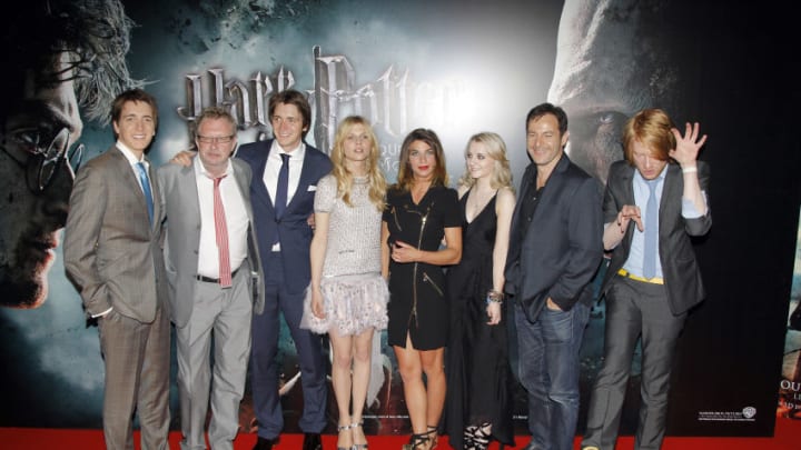 Cast members of the film 'Harry Potter and the Deathly Hallows Part 2' pose upon arrival for a screening on July 12, 2011 in Paris, of the last movie of the Harry Potter franchise, premiering tonight in France, Switzerland and Belgium. From L : British actors James Phelps, Mark Williams, Oliver Phelps, French actress Clémence Poésy, British actress Natalia Tena, Irish actress Evanna Lynch, British actor Jason Isaacs and Irish actor Domhnall Gleeson. AFP PHOTO / PATRICK KOVARIK (Photo credit should read PATRICK KOVARIK/AFP/Getty Images)