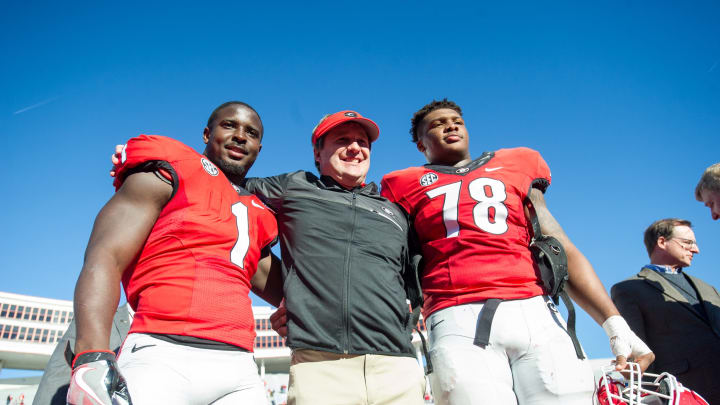 MEMPHIS, TN – DECEMBER 30: Georgia football head coach Kirby Smart poses with running back Sony Michel (#1) of the Georgia Bulldogs and defensive tackle Trenton Thompson (#78) of the Georgia Bulldogs after defeating the TCU Horned Frogs at Liberty Bowl Memorial Stadium on December 30, 2016 in Memphis, Tennessee. The Georgia Bulldogs defeated the TCU Horned Frogs 31-23. (Photo by Michael Chang/Getty Images)