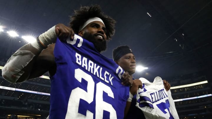 ARLINGTON, TX - SEPTEMBER 16: (L-R) Ezekiel Elliott #21 of the Dallas Cowboys trades game jersey with Saquon Barkley #26 of the New York Giants at AT&T Stadium on September 16, 2018 in Arlington, Texas. (Photo by Ronald Martinez/Getty Images)