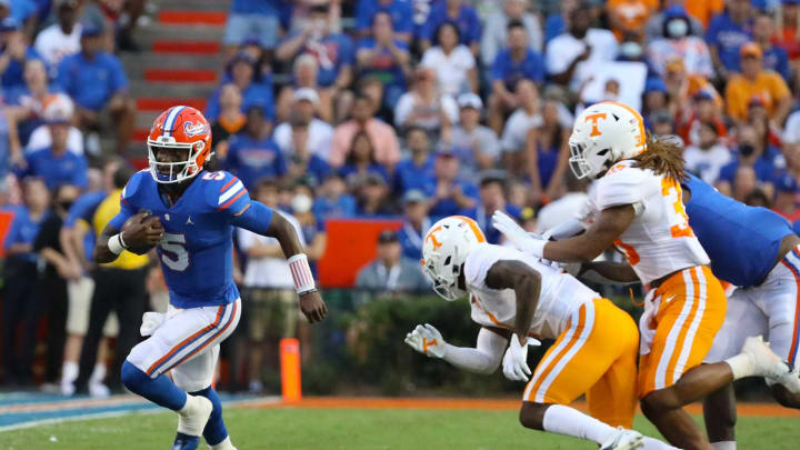 Florida Gators quarterback Emory Jones (5) runs for a first down the football game between the Florida Gators and Tennessee Volunteers, at Ben Hill Griffin Stadium in Gainesville, Fla. Sept. 25, 2021.Flgai 092521 Ufvs Tennesseefb 19