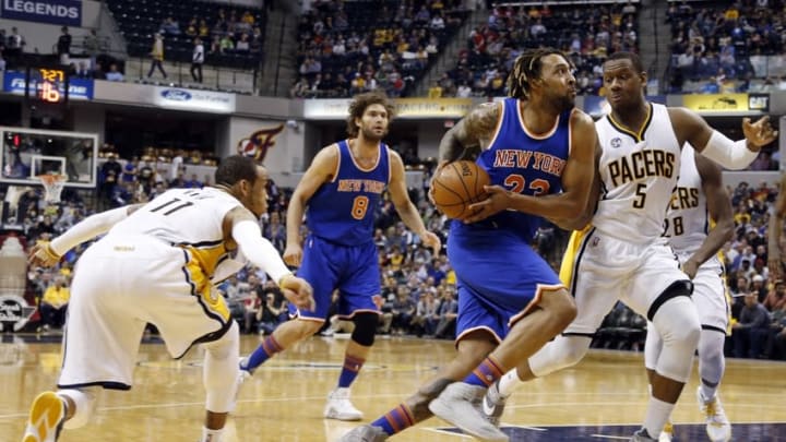 Apr 12, 2016; Indianapolis, IN, USA; New York Knicks forward Derrick Williams (23) drives to the basket against Indiana Pacers forward Lavoy Allen (5) at Bankers Life Fieldhouse. Indiana defeats New York 102-90. Mandatory Credit: Brian Spurlock-USA TODAY Sports