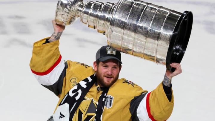 LAS VEGAS, NEVADA - JUNE 13: Jonathan Quick #32 of the Vegas Golden Knights hoists the Stanley Cup after the team's 9-3 victory over the Florida Panthers in Game Five of the 2023 NHL Stanley Cup Final at T-Mobile Arena on June 13, 2023 in Las Vegas, Nevada. The Golden Knights won the series four games to one. (Photo by Ethan Miller/Getty Images)