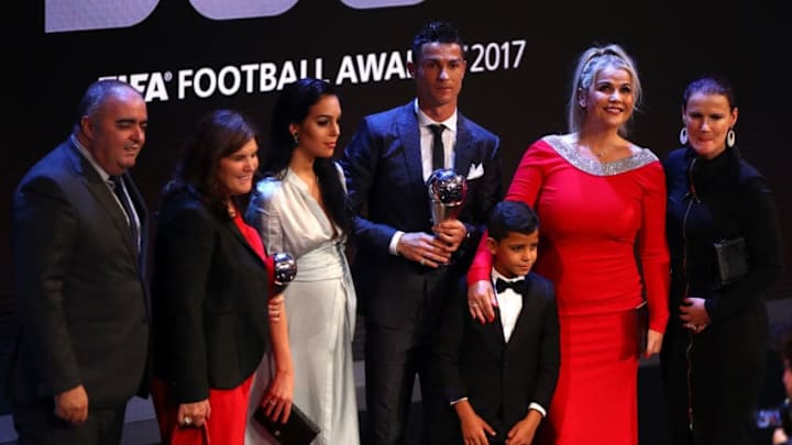 LONDON, ENGLAND - OCTOBER 23: Cristiano Ronaldo of Portugal and Real Madrid CF wins The best Fifa men's player and celebrates on stage with Georgina Rodriguez and Cristiano Ronaldo Junior during The Best FIFA Football Awards Show on October 23, 2017 in London, England. (Photo by Michael Steele/Getty Images)
