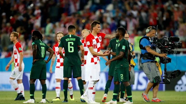 KALININGRAD, RUSSIA - JUNE 16: Mario Mandzukic of Croatia consoles Bryan Idowu of Nigeria after the 2018 FIFA World Cup Russia group D match between Croatia and Nigeria at Kaliningrad Stadium on June 16, 2018 in Kaliningrad, Russia. (Photo by Julian Finney/Getty Images)