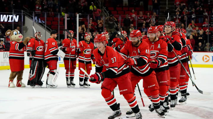 RALEIGH, NC - DECEMBER 05: Andrei Svecnikov #37 of the Carolina Hurricanes and teammates participate in a Storm Surge following a victory over the San Jose Sharks during an NHL game on December 5, 2019 at PNC Arena in Raleigh, North Carolina. (Photo by Gregg Forwerck/NHLI via Getty Images)