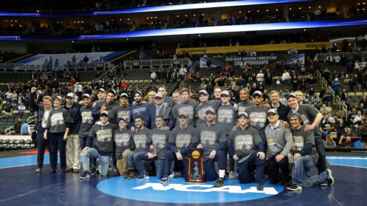 PITTSBURGH, PA - MARCH 23: Members and staff of the Penn State Nittany Lion wrestling team pose for a team photo after winning the team title of the NCAA Wrestling Championships on March 23, 2019 at PPG Paints Arena in Pittsburgh, Pennsylvania. (Photo by Hunter Martin/NCAA Photos via Getty Images)