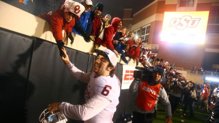 Nov 28, 2015; Stillwater, OK, USA; Oklahoma Sooners quarterback Baker Mayfield (6) celebrates with fans following the game against the Oklahoma State Cowboys at Boone Pickens Stadium. The Sooners defeated the Cowboys 58-23. Mandatory Credit: Mark J. Rebilas-USA TODAY Sports