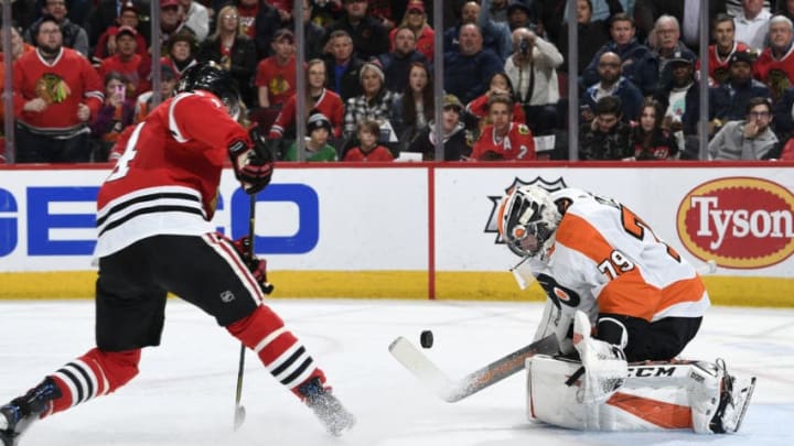 CHICAGO, IL - MARCH 21: The puck approaches goalie Carter Hart #79 of the Philadelphia Flyers in the first period against the Chicago Blackhawks at the United Center on March 21, 2019 in Chicago, Illinois. (Photo by Bill Smith/NHLI via Getty Images)