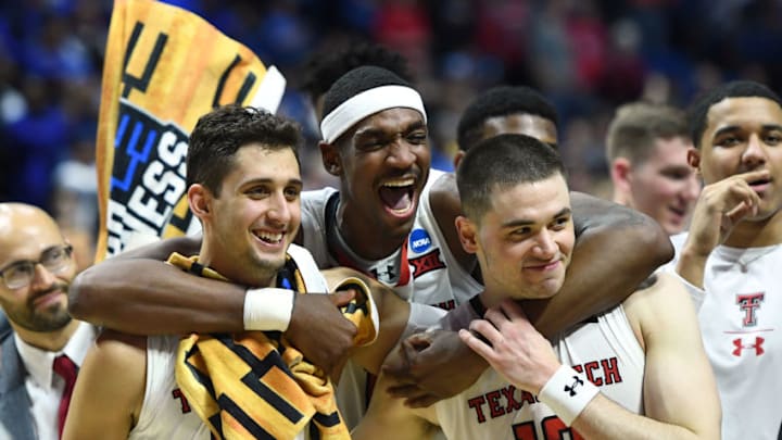 TULSA, OKLAHOMA - MARCH 24: (L-R) Davide Moretti #25, Tariq Owens #11, and Matt Mooney #13 of the Texas Tech Red Raiders celebrate their 78-58 victory over the Buffalo Bulls after their second round game of the 2019 NCAA Men's Basketball Tournament at BOK Center on March 24, 2019 in Tulsa, Oklahoma. (Photo by Stacy Revere/Getty Images)