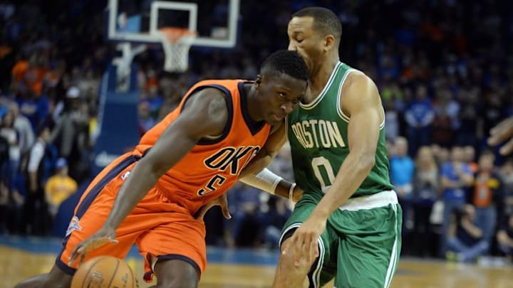 Dec 11, 2016; Oklahoma City, OK, USA; Oklahoma City Thunder guard Victor Oladipo (5) drives to the basket against Boston Celtics guard Avery Bradley (0) during the first quarter at Chesapeake Energy Arena. Mandatory Credit: Mark D. Smith-USA TODAY Sports