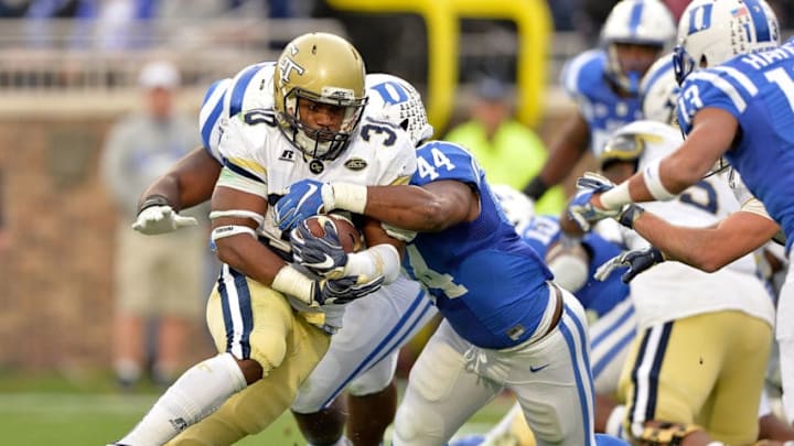 DURHAM, NC - NOVEMBER 18: Joe Giles-Harris #44 of the Duke Blue Devils tackles KirVonte Benson #30 of the Georgia Tech Yellow Jackets during their game at Wallace Wade Stadium on November 18, 2017 in Durham, North Carolina. (Photo by Grant Halverson/Getty Images)