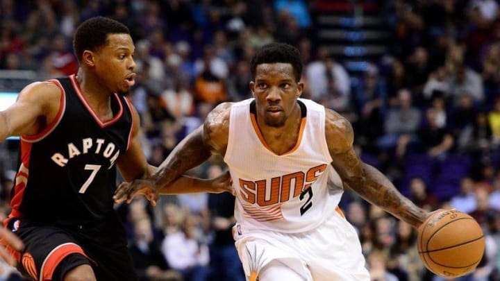 Dec 29, 2016; Phoenix, AZ, USA; Phoenix Suns guard Eric Bledsoe (2) handles the ball against Toronto Raptors guard Kyle Lowry (7) in the second half of the NBA game at Talking Stick Resort Arena. The Suns won 99-91. Mandatory Credit: Jennifer Stewart-USA TODAY Sports