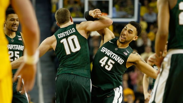 ANN ARBOR, MI – JANUARY 06: Matt Costello #10 of the Michigan State Spartans celebrates a second half dunk with Denzel Valentine #45 while playing the Michigan Wolverines at Crisler Center on January 6, 2016 in Ann Arbor, Michigan. (Photo by Gregory Shamus/Getty Images)