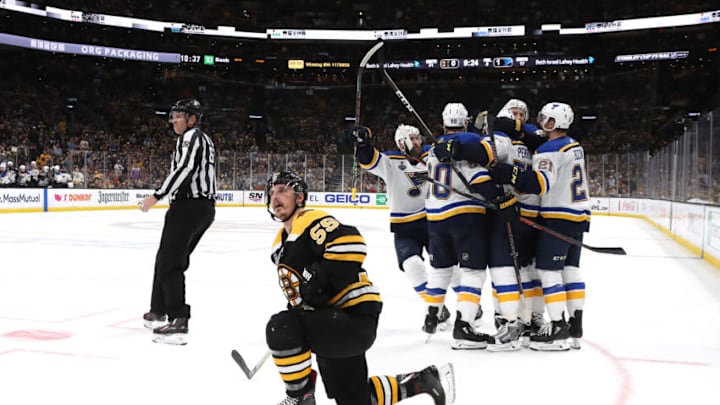 BOSTON, MASSACHUSETTS - JUNE 06: David Perron #57 of the St. Louis Blues is congratulated by his teammates after scoring a third period goal as Noel Acciari #55 of the Boston Bruins in Game Five of the 2019 NHL Stanley Cup Final at TD Garden on June 06, 2019 in Boston, Massachusetts. (Photo by Bruce Bennett/Getty Images)