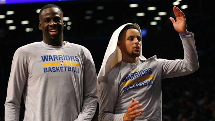 Dec 6, 2015; Brooklyn, NY, USA; Golden State Warriors forward Draymond Green (23) and Golden State Warriors guard Stephen Curry (30) react after a three point shot by Golden State during the second half at Barclays Center. The Golden State Warriors defeated the Brooklyn Nets 114-98. Mandatory Credit: Noah K. Murray-USA TODAY Sports