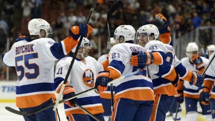Nov 5, 2014; Anaheim, CA, USA; New York Islanders center John Tavares (91) celebrates with his team after scoring a goal to win the game during overtime against the Anaheim Ducks at Honda Center. The New York Islanders defeated the Anaheim Ducks in overtime with a final score of 3-2. Mandatory Credit: Kelvin Kuo-USA TODAY Sports