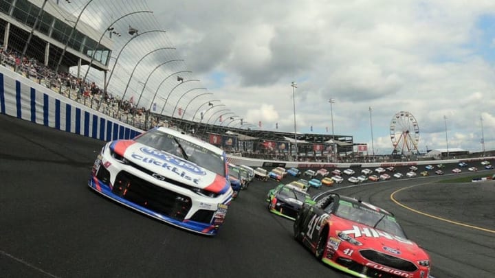 CHARLOTTE, NC - SEPTEMBER 30: Kurt Busch, driver of the #41 Haas Automation/Monster Energy Ford, and AJ Allmendinger, driver of the #47 Kroger ClickList Chevrolet, lead the field at the start of the Monster Energy NASCAR Cup Series Bank of America Roval 400 at Charlotte Motor Speedway on September 30, 2018 in Charlotte, North Carolina. (Photo by Chris Graythen/Getty Images)