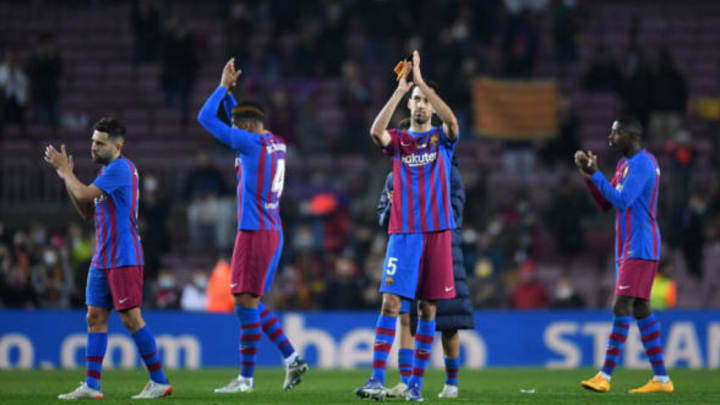 Barcelona captain Sergio Busquets applauds the fans at the Camp Nou after his team defeated Elche in a LaLiga match on Dec. 18, 2021. (Photo by Alex Caparros/Getty Images)