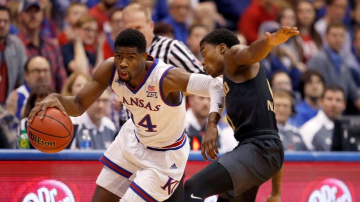 LAWRENCE, KS - NOVEMBER 24: Malik Newman #14 of the Kansas Jayhawks drives past Kendrick Nunn #1 of the Oakland Golden Grizzlies during the game at Allen Fieldhouse on November 24, 2017 in Lawrence, Kansas. (Photo by Jamie Squire/Getty Images)