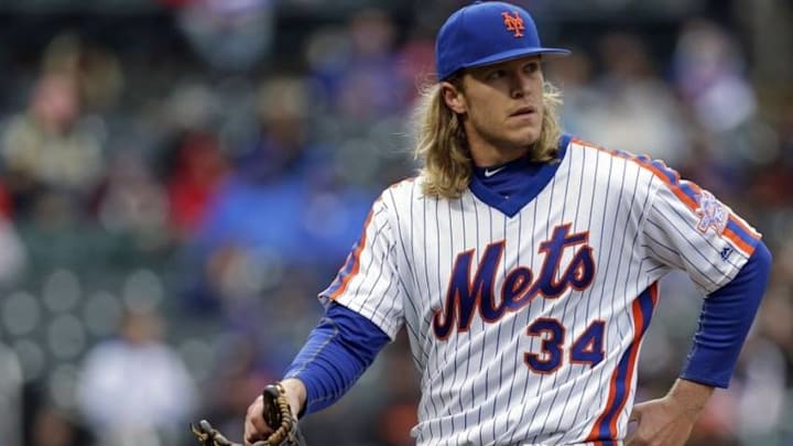 May 1, 2016; New York City, NY, USA; New York Mets starting pitcher Noah Syndergaard (34) walks to the dugout against the San Francisco Giants during the fourth inning at Citi Field. Mandatory Credit: Adam Hunger-USA TODAY Sports