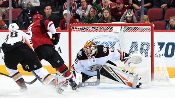 GLENDALE, ARIZONA - SEPTEMBER 21: Goalie Kevin Boyle #40 of the Anaheim Ducks makes a save on the shot by Christian Dvorak #18 of the Arizona Coyotes as Derek Grant #38 of the Ducks defends during the third period of an NHL preseason game at Gila River Arena on September 21, 2019 in Glendale, Arizona. (Photo by Norm Hall/NHLI via Getty Images)
